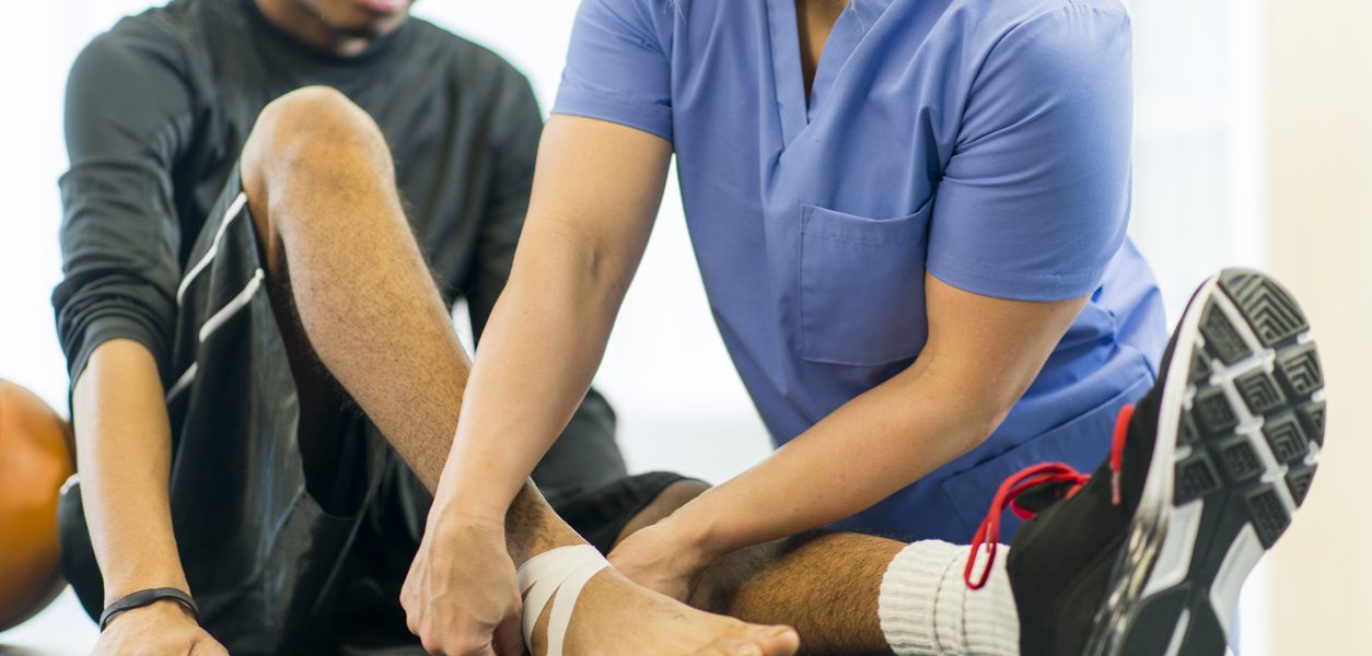 Physical Therapy An athlete receiving rehibilitative care for a sports injury.